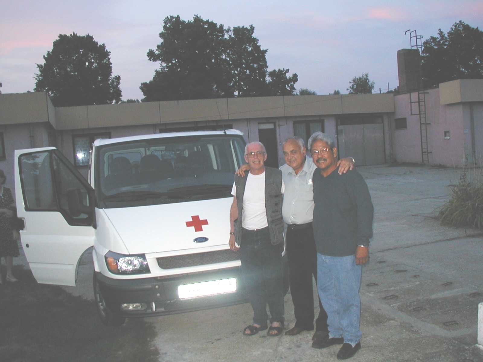 Fr. John, Dr. Ladaby, Frank Mendiola and the new bus at Barcs, Hungary.
